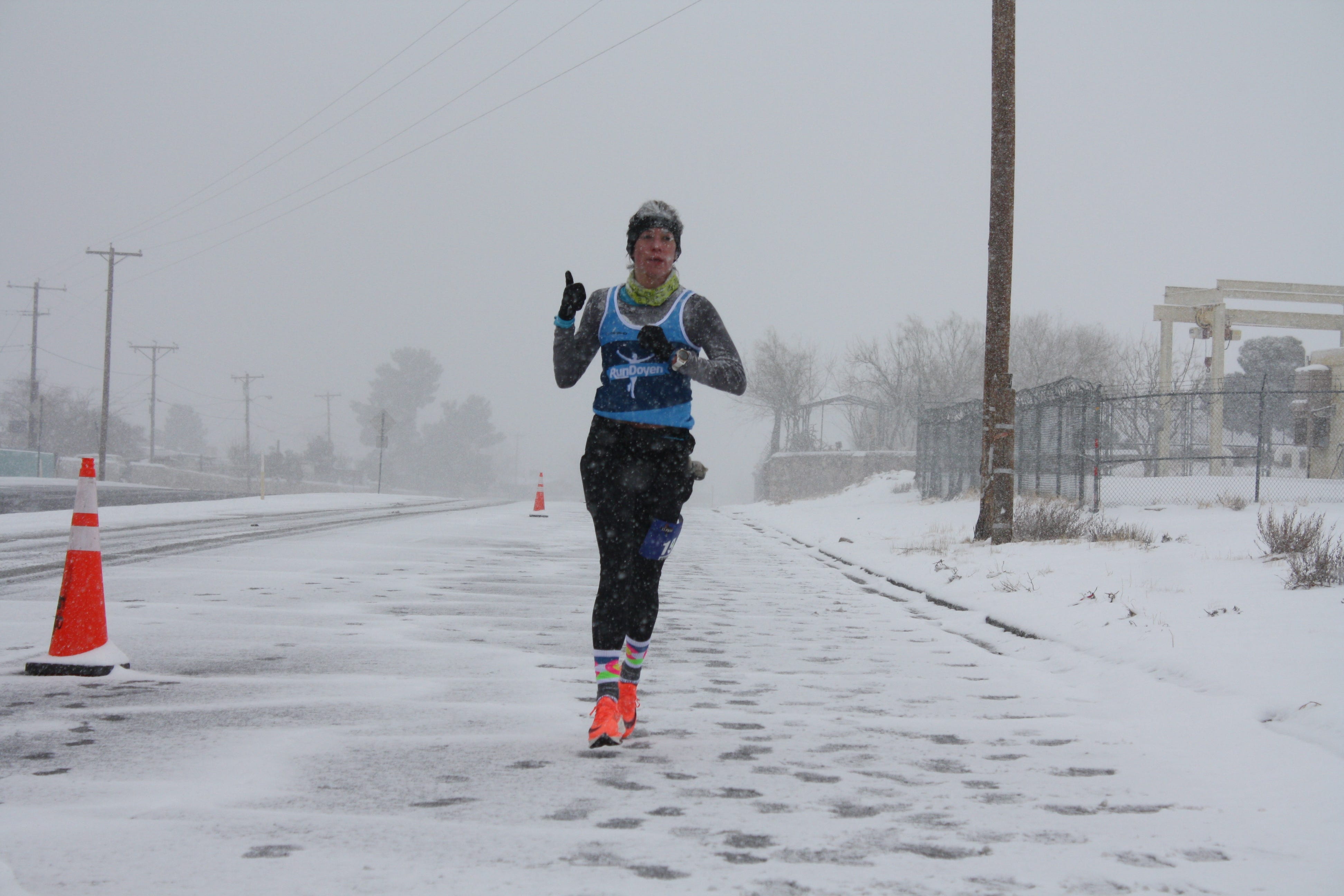 Runners ran in the snow at the Michelob Ultra El Paso Marathon on Sunday, Feb. 14, 2021. The race had a limited number of runners and virtual runners due to the COVID-19 safety measures.