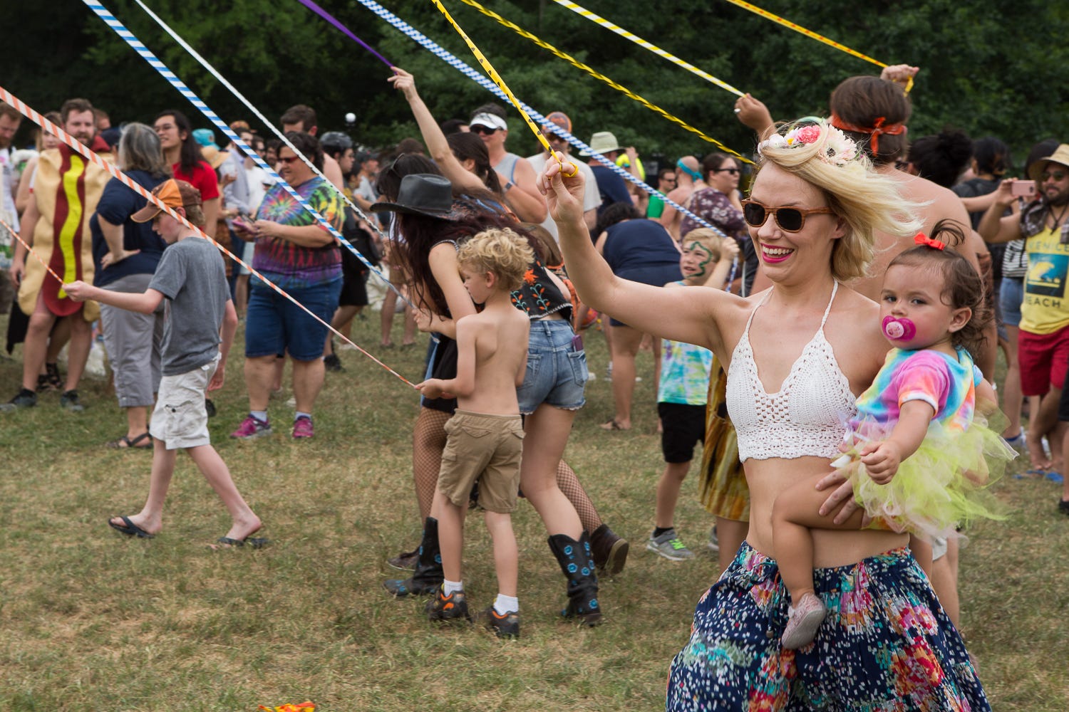 Ashley Heck and Ivy Hernandez danced around the maypole during Eeyore's Birthday in Pease Park in 2017.