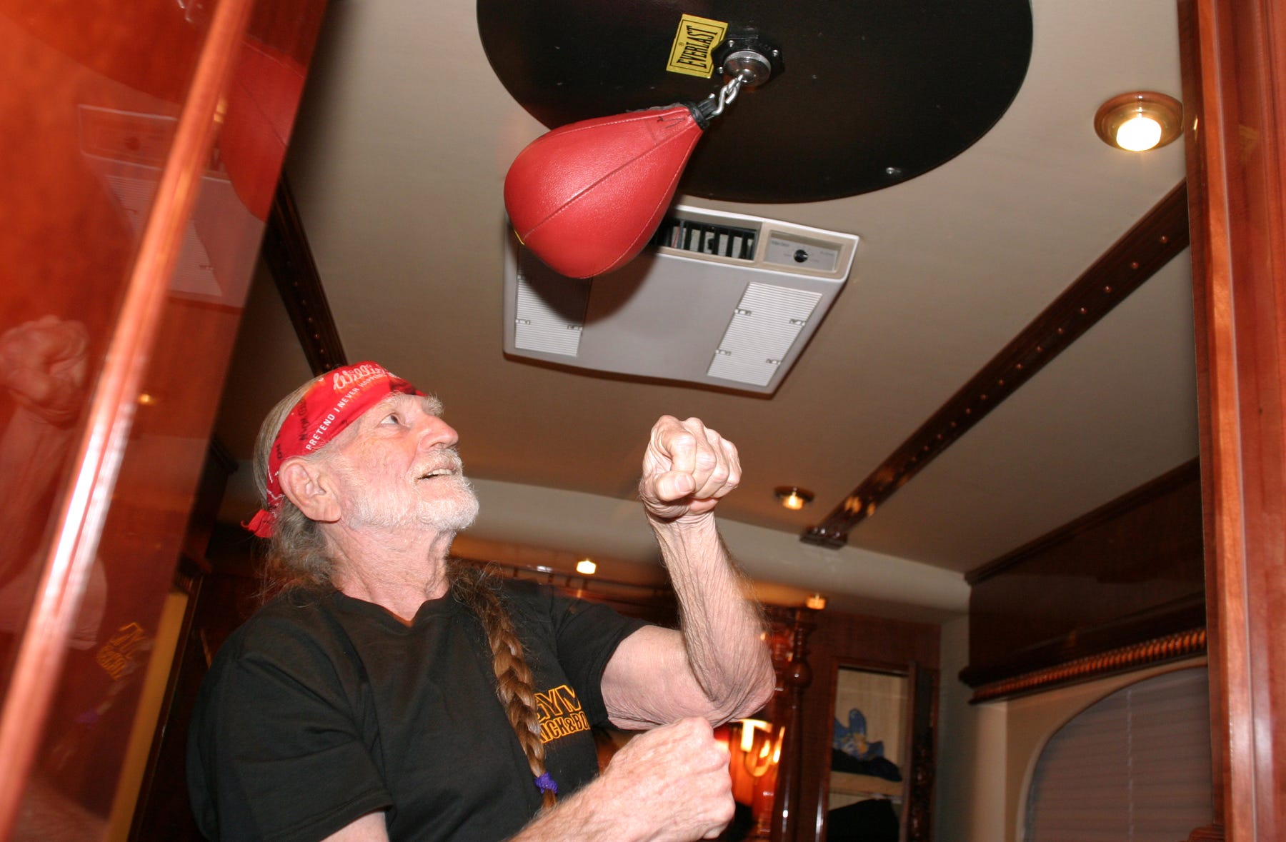 Willie Nelson has a speed bag mounted on the ceiling of his bedroom in his tour bus so he can practice his punches for fight scenes in Newline Cinema's western "Life Is A Hoss" on March 14, 2005. Nelson, who earned his black belt in Tai Kwon Do at the age of 70, is working again with Master Teacher Sam Um of Austin. Um has been Nelson's instructor for about 10 years.