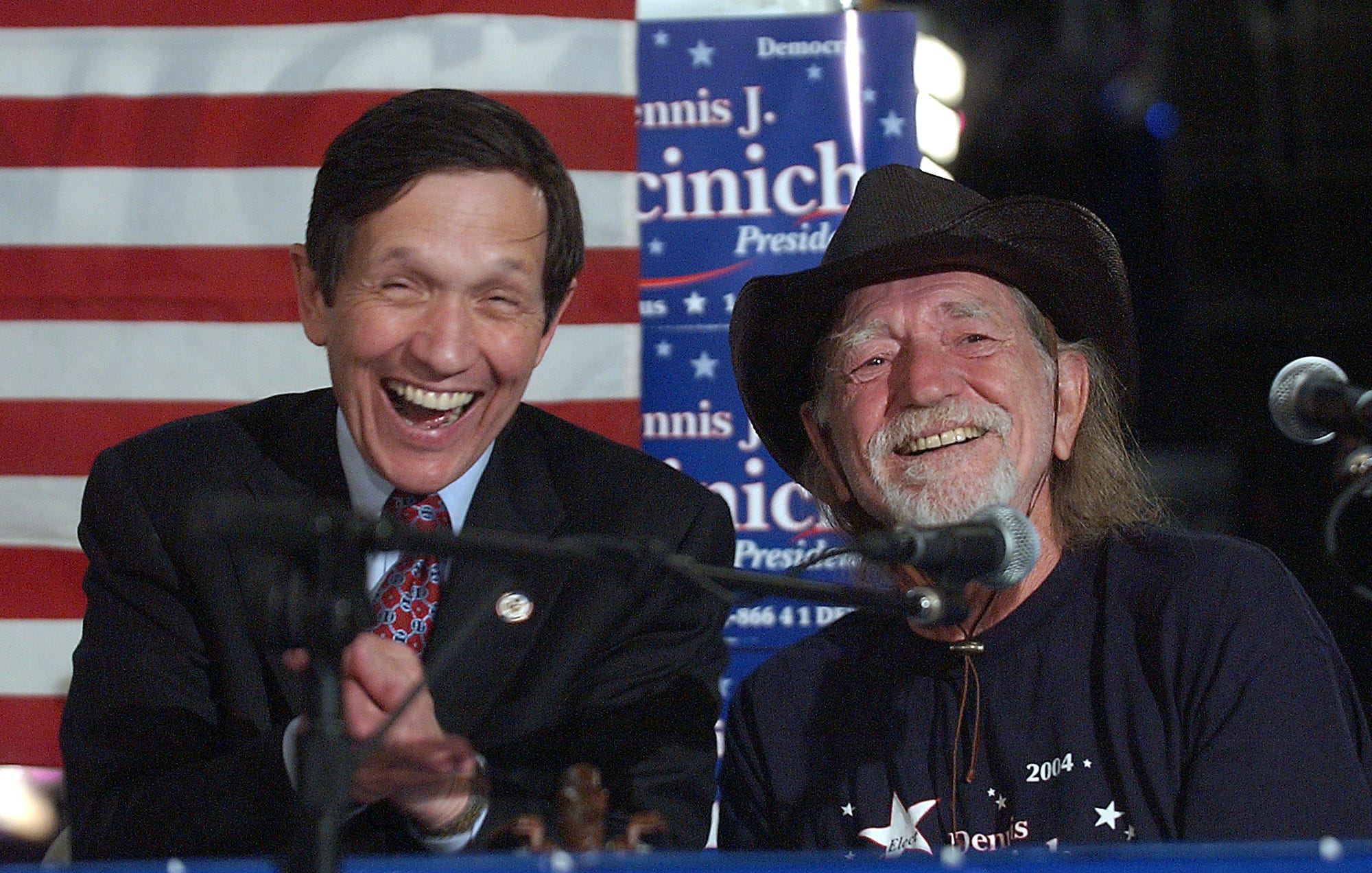 Democratic presidential candidate Dennis Kucinich, left, laughs at a comment made by Willie Nelson during a press conference at the Austin Music Hall in Austin, Texas, on Saturday, January 3, 2004.