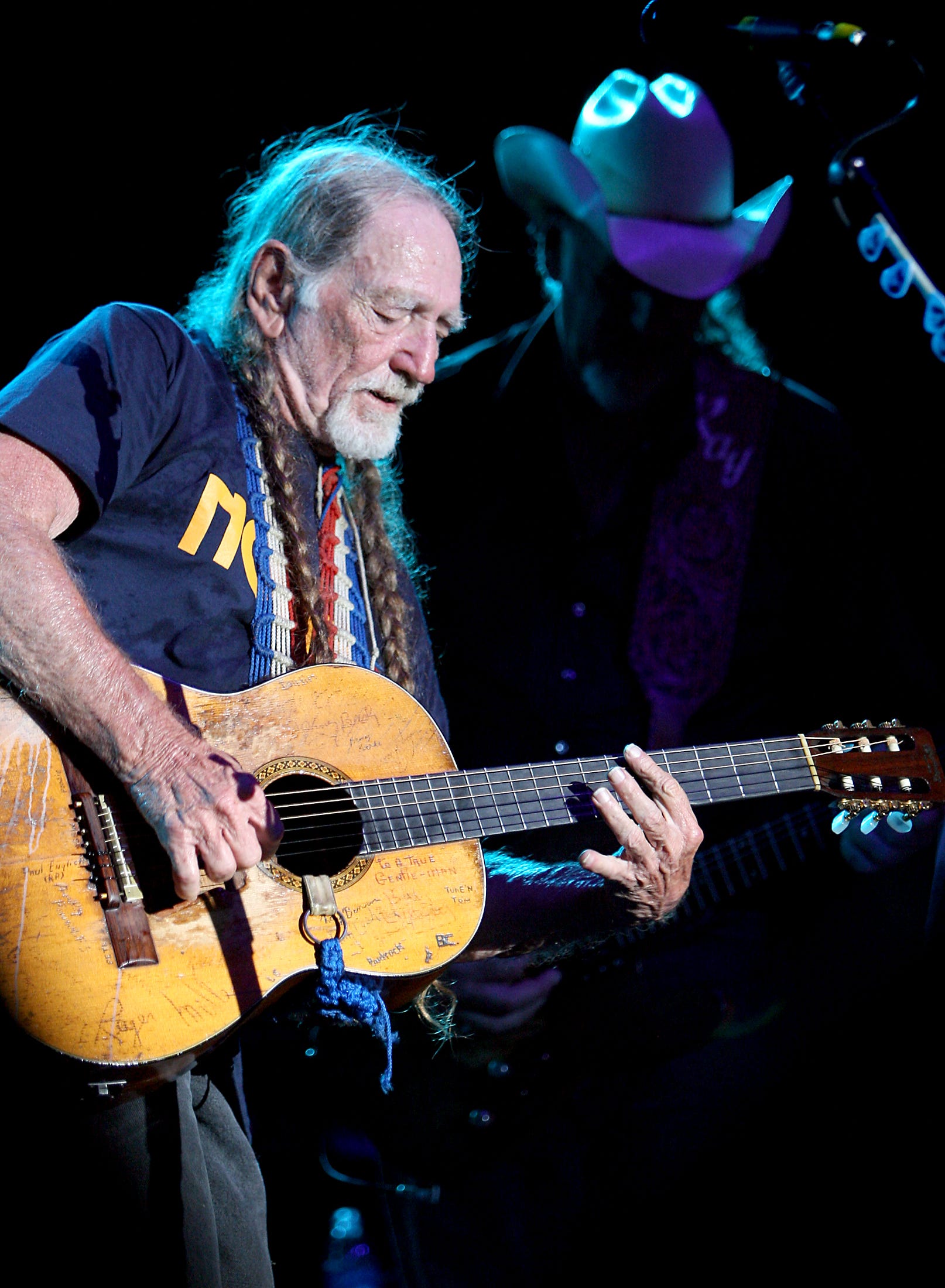 Willie Nelson at the Back Yard in Austin on August 10, 2007, with Ray Benson joining in at background right.