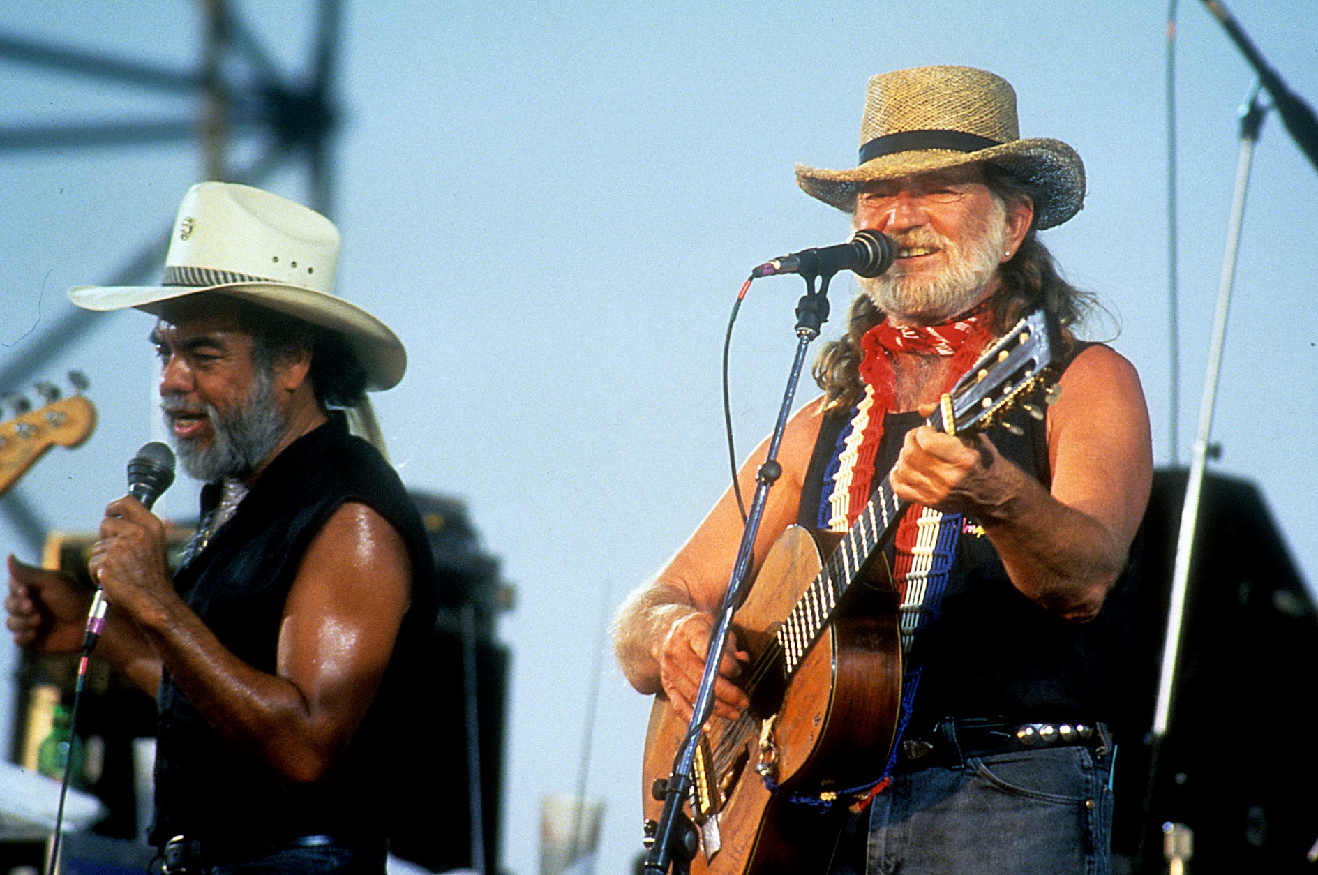 Willie Nelson performs with Little Joe Hernandez at the Willie Nelson's 4th of July picnic event on July 4, 1990.