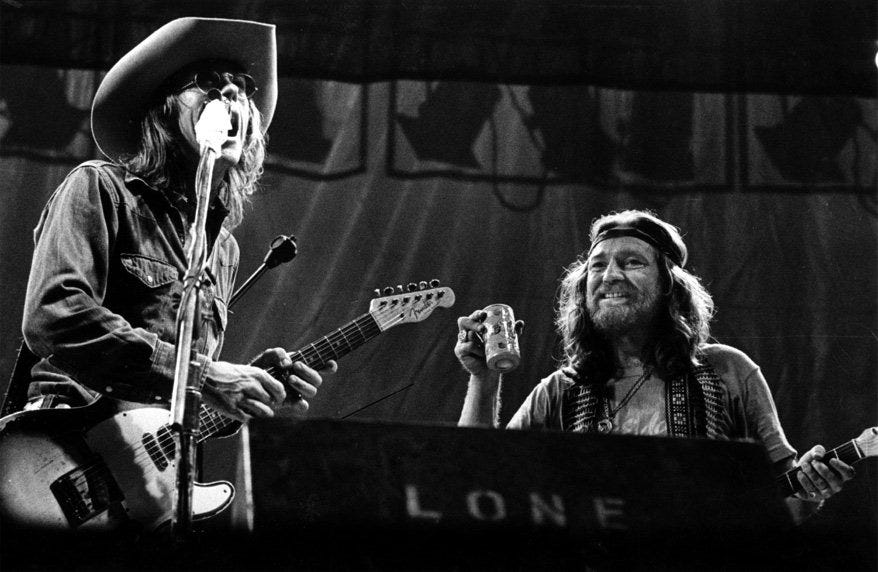 Willie Nelson joins Doug Sahm on stage at Willie's 4th of July Picnic on July 4, 1976.